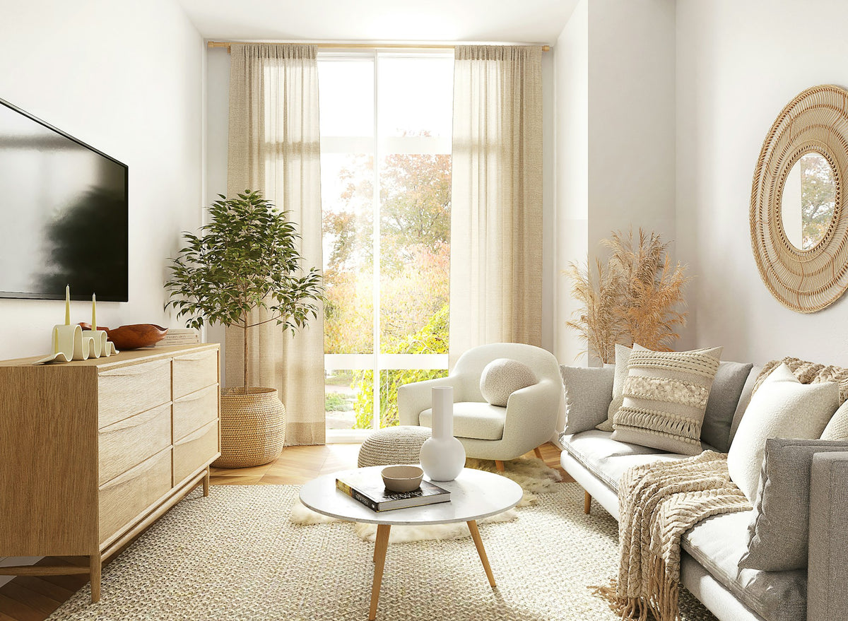 Sunlit living room with plants and soft furnishings