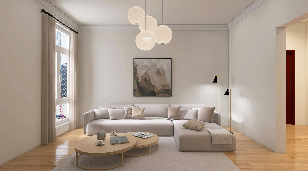 Calm living room with a pale sofa and artwork
